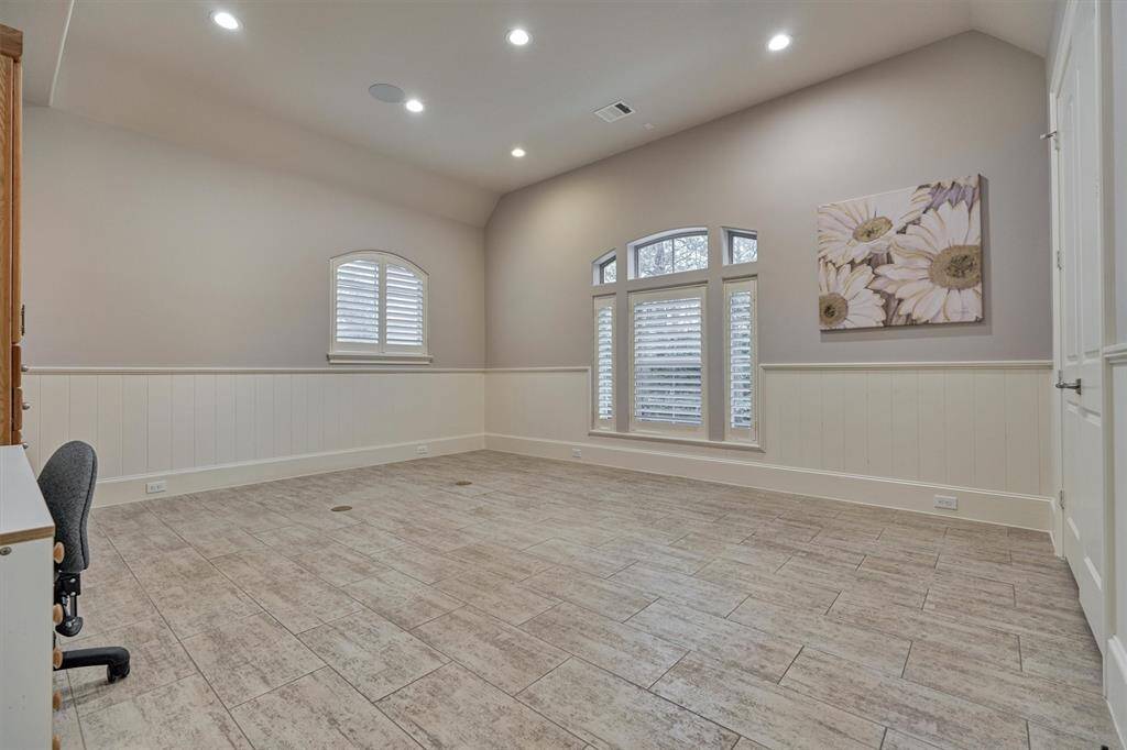 Oversized utility/laundry room with built-ins and room for second refrigerator.