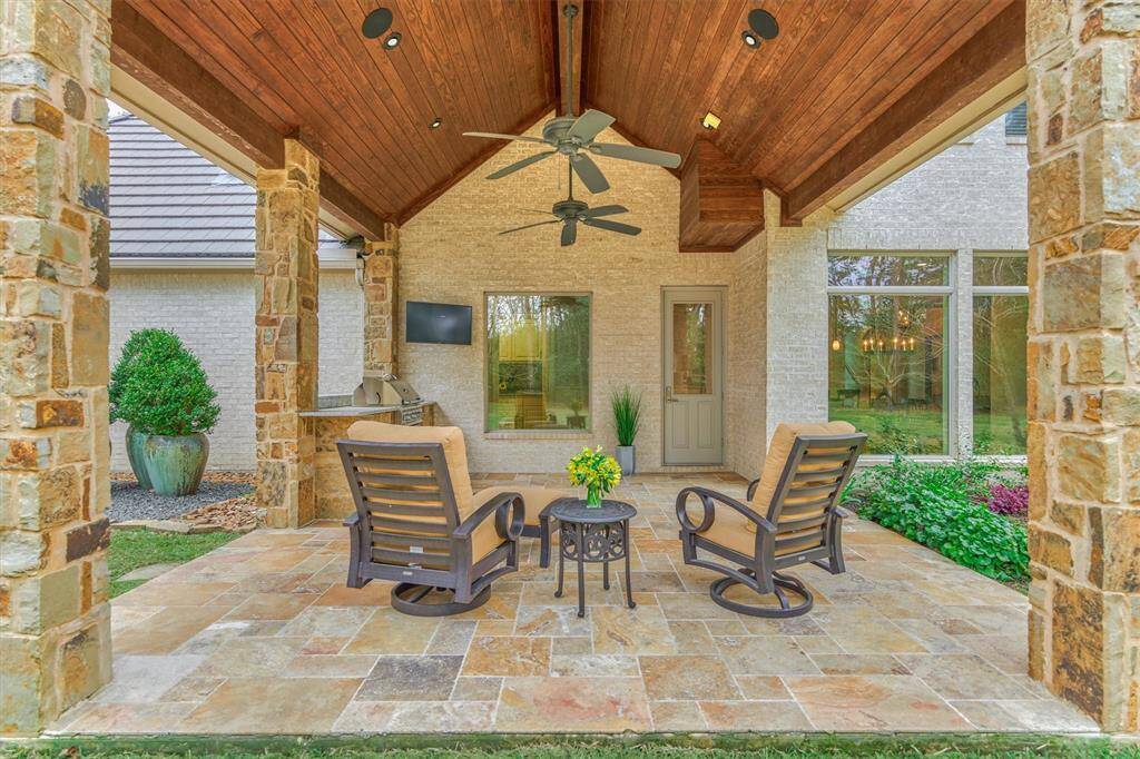 18 x 20 tiled covered patio with stained v-groove ceiling.