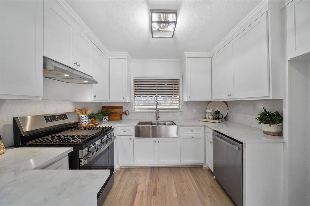 Thoughtfully planned, the counter tops surround the kitchen and included is plenty of cabinet & drawer storage along with a pantry.