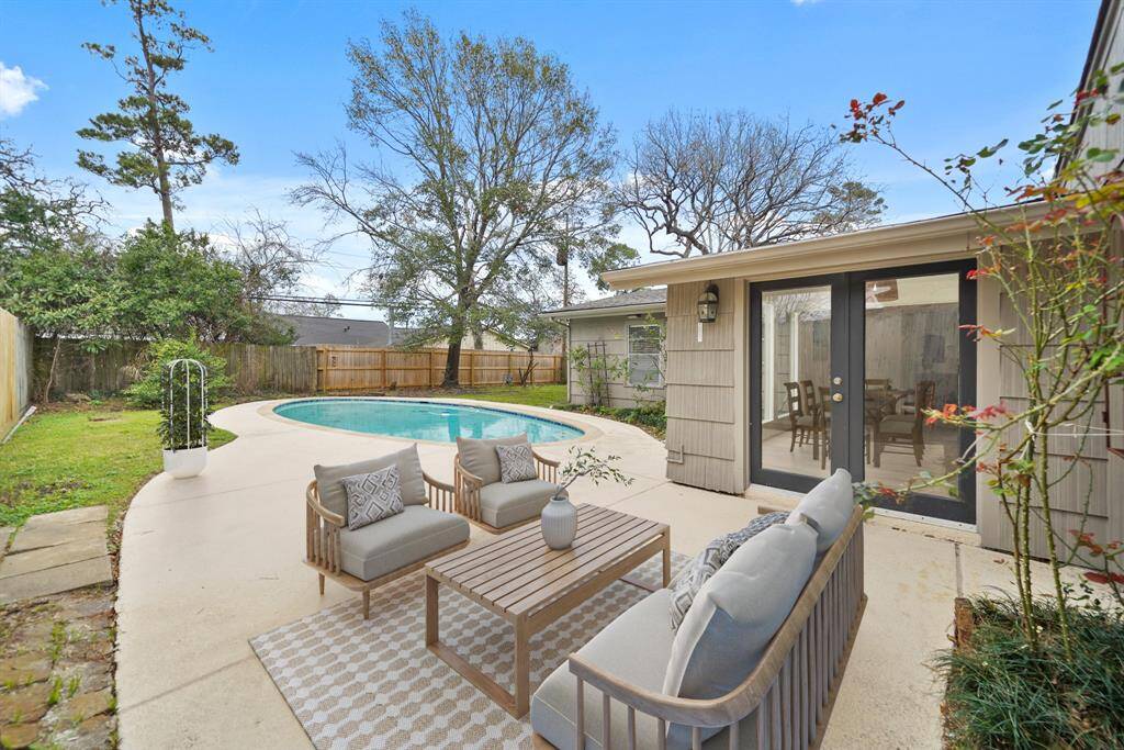 A 19' x 15' patio area is accessible just off the French doors from the dining room. This photo has been virtually staged.