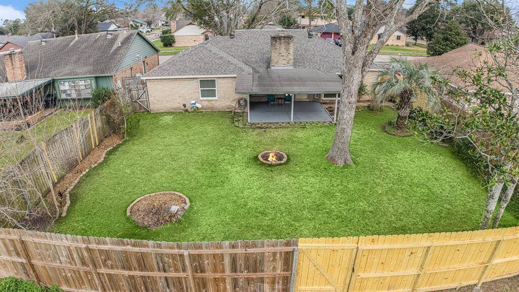 OVERVIEW SHOT OF BACKYARD (HAS A GATE THAT OPENS TO  LAND IN BACK)
