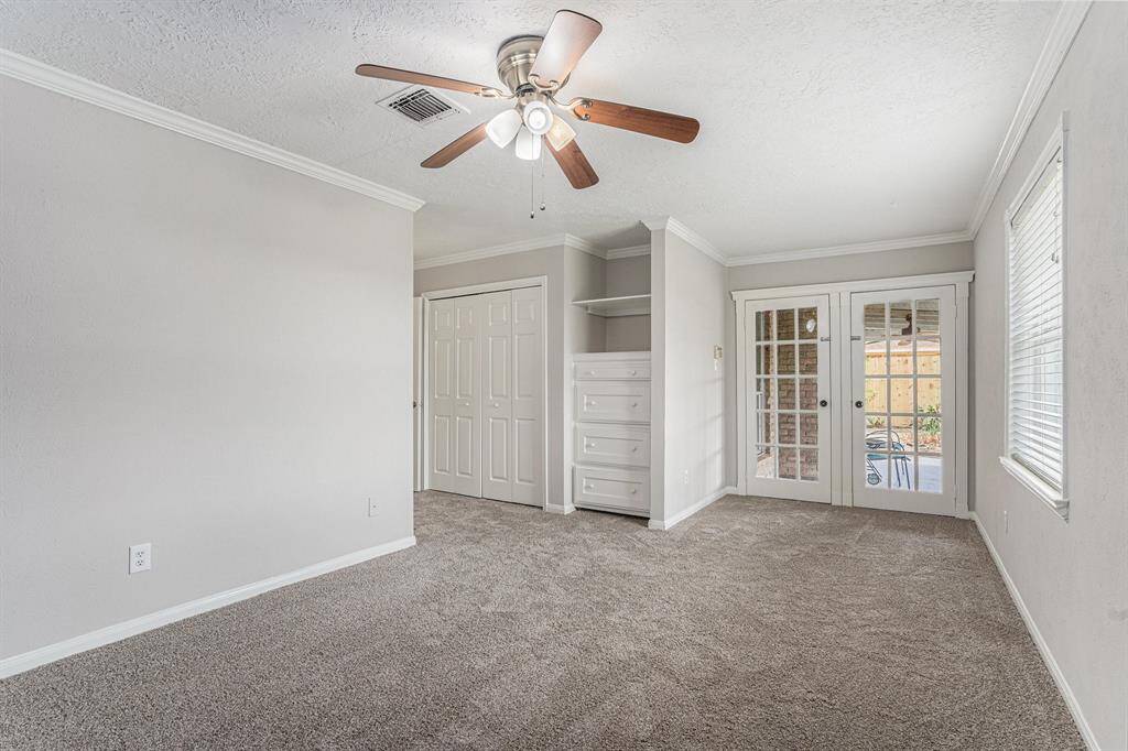 PRIMARY MASTER WITH BUILTIN DRAWERS/SHELVES,2 CLOSETS AND FRENCH DOORS LEAD TO BACKYARD COVERED PATIO