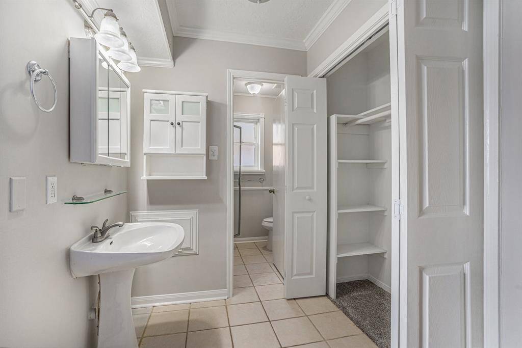 PICTURE OF PRIMARY BEDROOM WITH NEWLY UPDATED WALK IN SHOWER