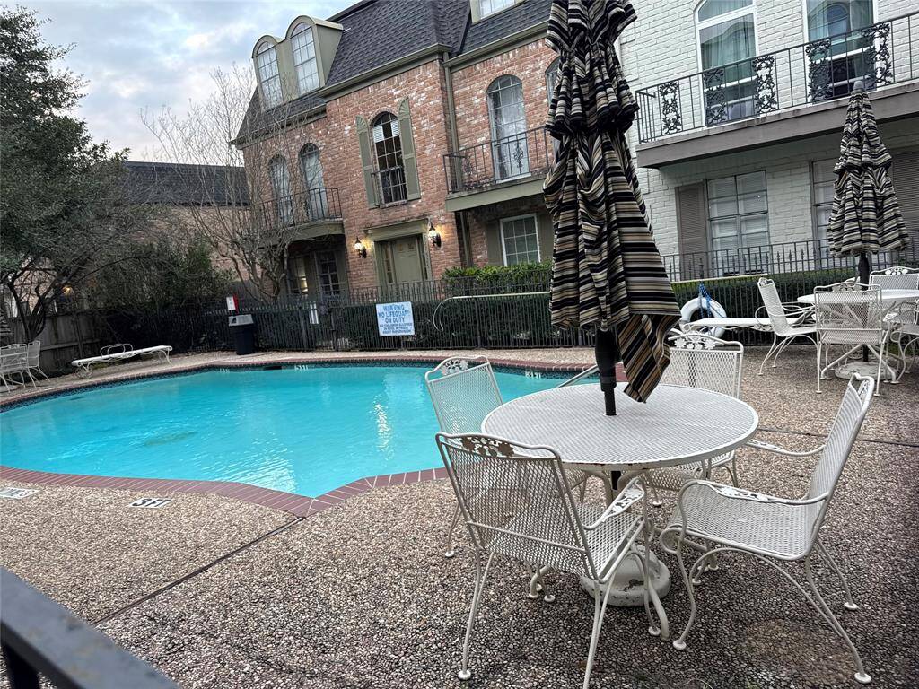 Another view of pool with ample seating