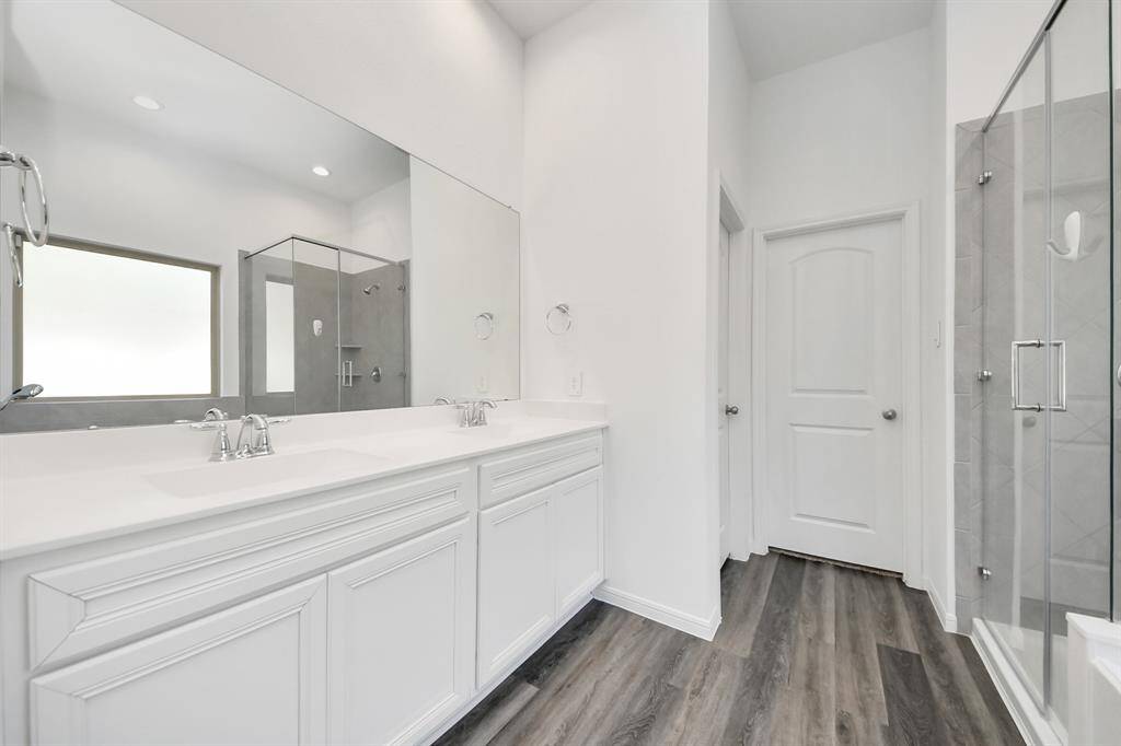Master bathroom with large soaking tub and separate shower.