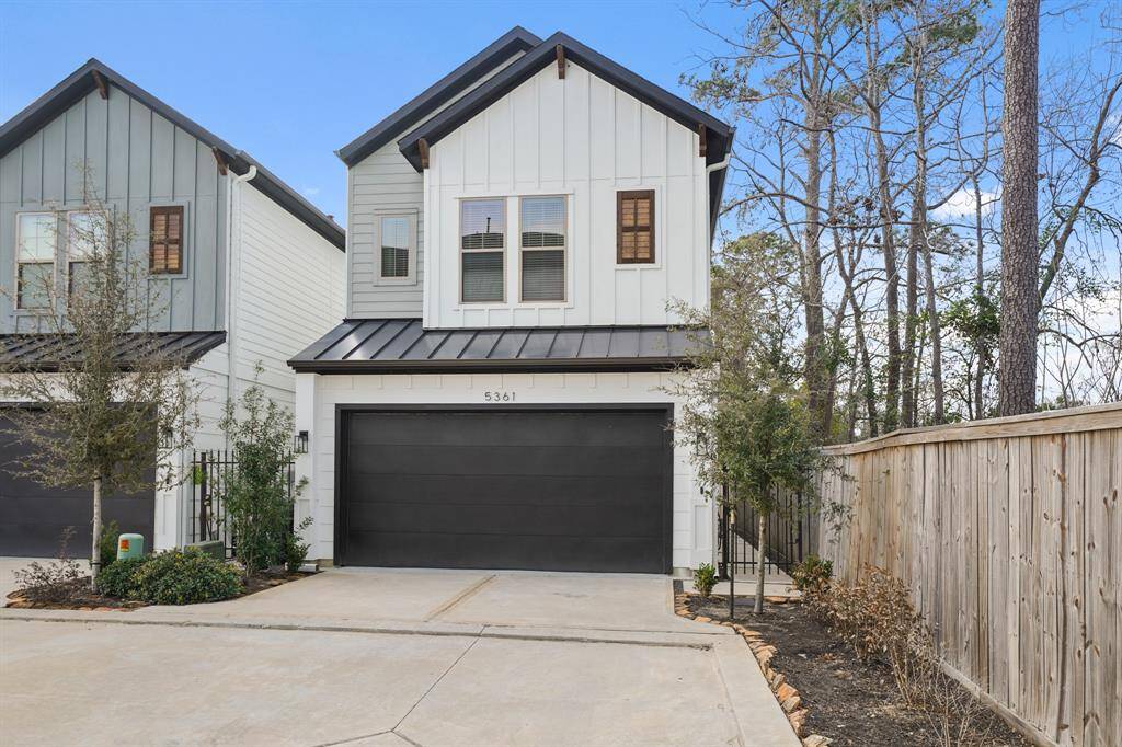 Located in the gated community of Creekmont Grove and situated on a corner lot sits 5361 Creekmont Oaks Lane. Completed in 2022, this beautiful free-standing home includes a cement board exterior highlighted by decorative wood-stained corbels, metal accent roof above the garage and a double-wide driveway leading to the home's two-car attached garage with an automatic garage door opener flanked by coach lantern lighting.