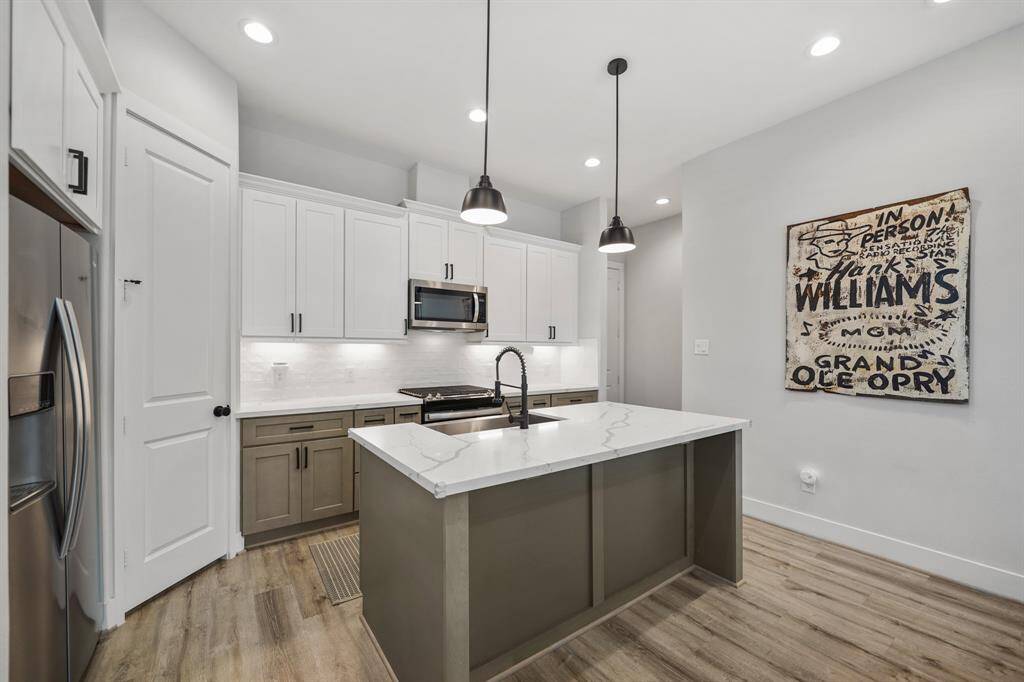 Thoughtfully planned, plenty of counter, cabinet & drawer storage with soft-close cabinets & drawers plus a walk-in pantry is included.