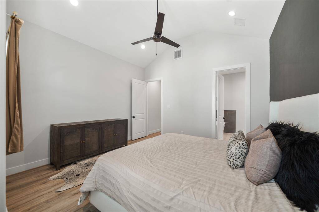 A view of the owner's bedroom with access to the private bath is just through the door on the right.