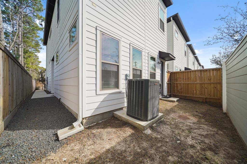 The side yard wraps the corner to the private backyard with no neighbors behind.