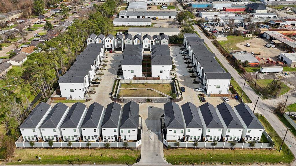 An aerial view of the community. 5361 Creekmont Oaks Lane is the home located in the lower left corner of this photo with guest parking available directly across from the home's two-car attached garage.