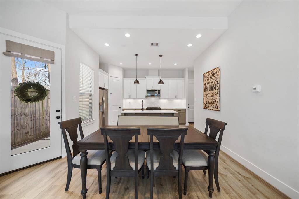 Positioned between the living room and kitchen, this dining space is perfect for casual to formal entertaining.