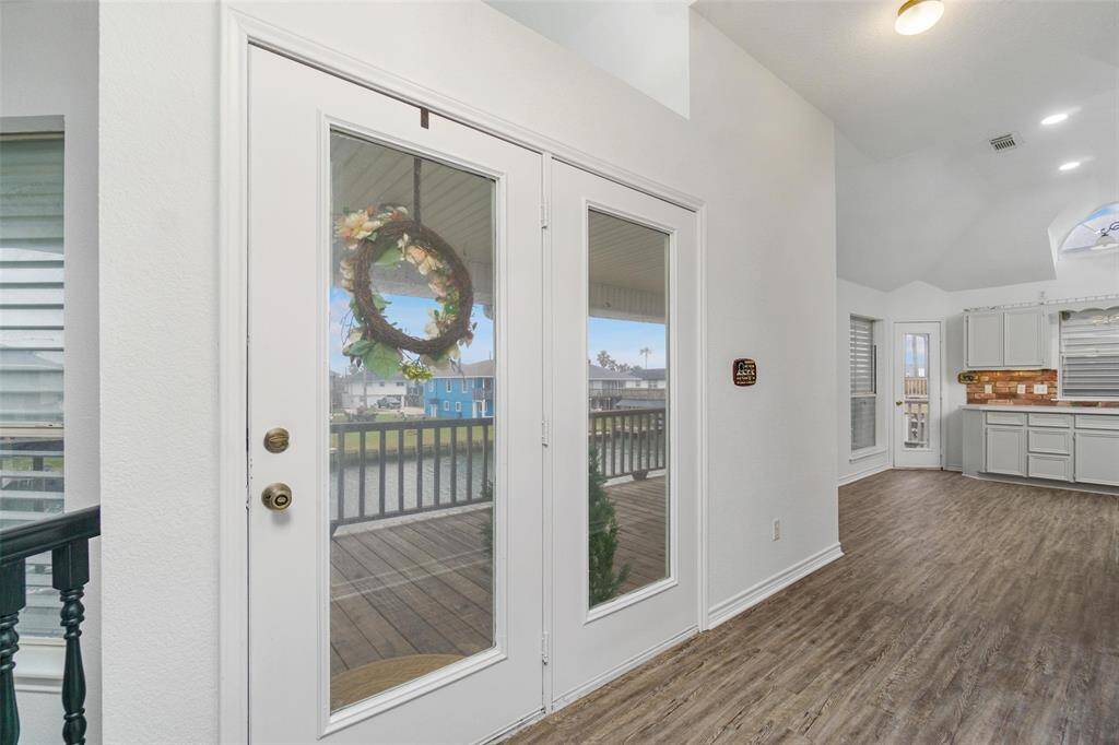 As you enter the home, the large updated kitchen/dining is on the left