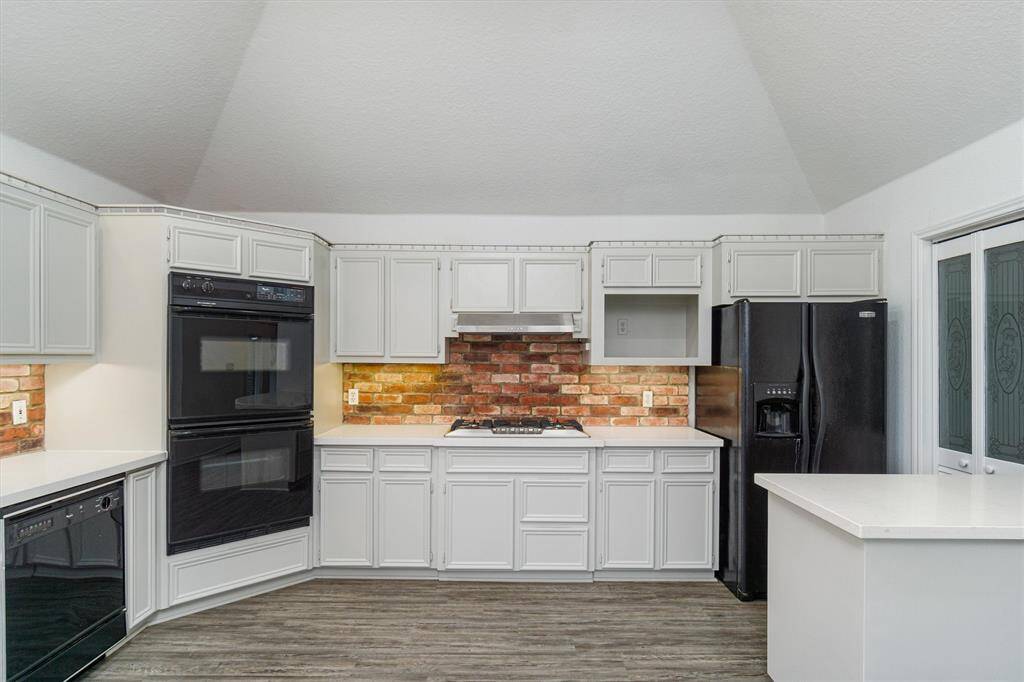 The kitchen has a walk in pantry and a dumbwaiter to make hauling groceries up easy and transporting food down when entertaining. The kitchen offers a double oven