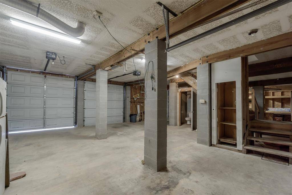 3 car garage with a half bath. Notice the dumbwaiter