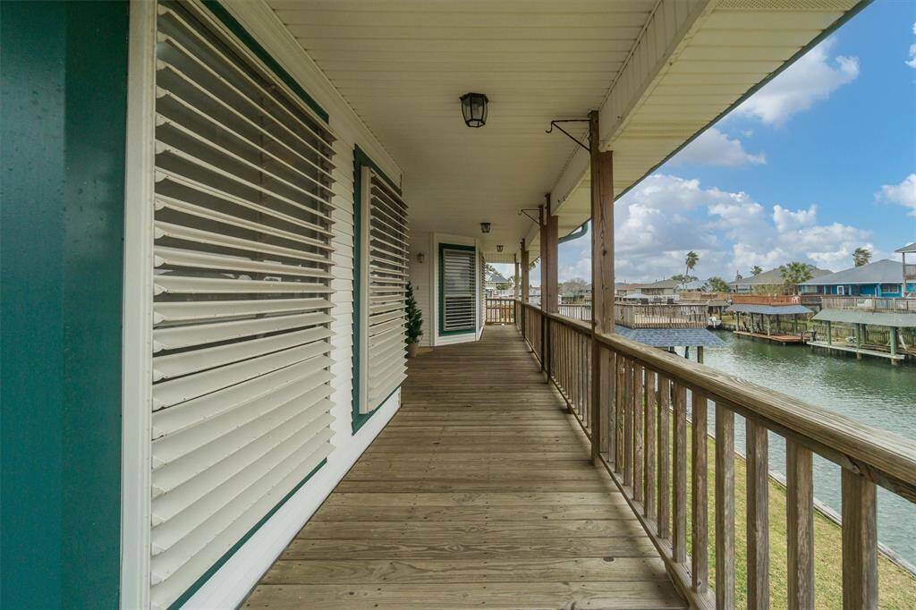 Oversized covered porch. Notice the storm shutters on the windows