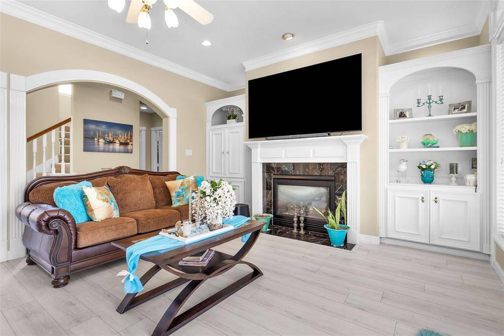 Gas log fireplace with built ins on each side