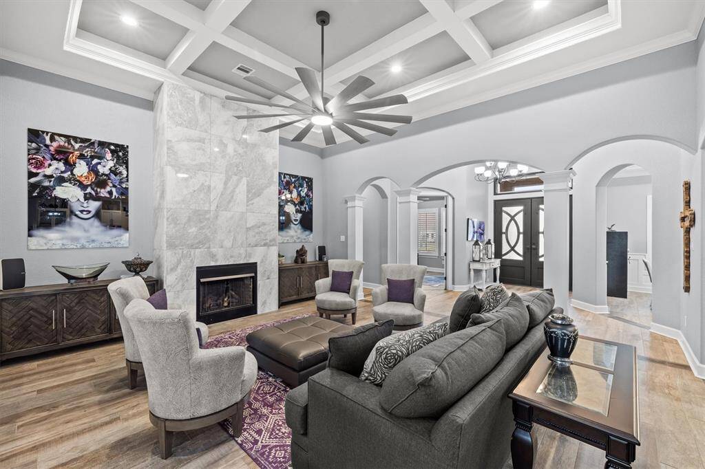 Great living room with gas fireplace and tray ceilings!