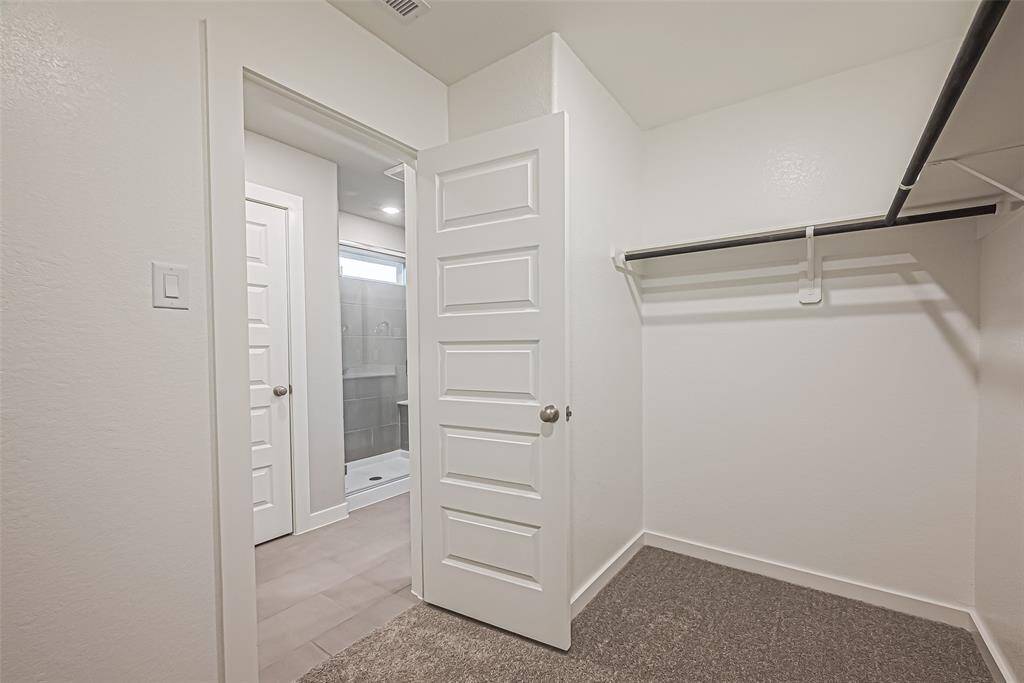 The primary bath also features a large walk-in closet.