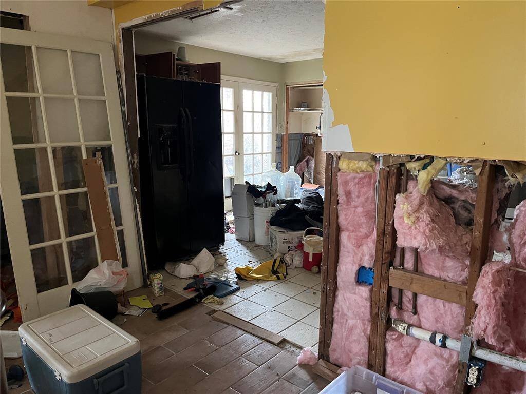 Some sheetrock is still missing. The house is packed with stuff that you can use or donate or throw away.