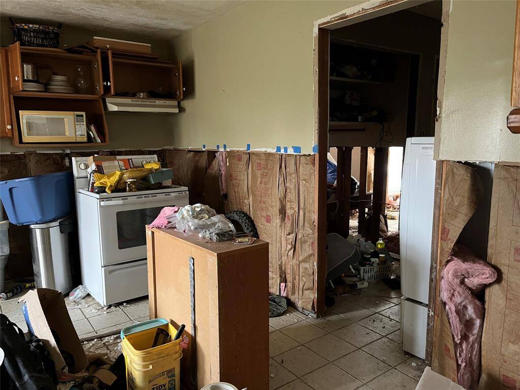There's a laundry area to the right and it looks like a possible bath.