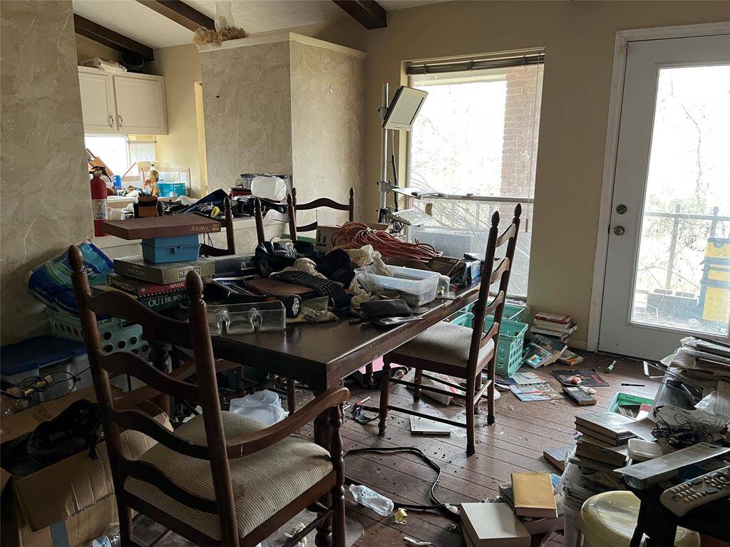 The dining room upstairs. The door leads to a balcony overlooking the back yard. Chocolate Bayou is out there somewhere.