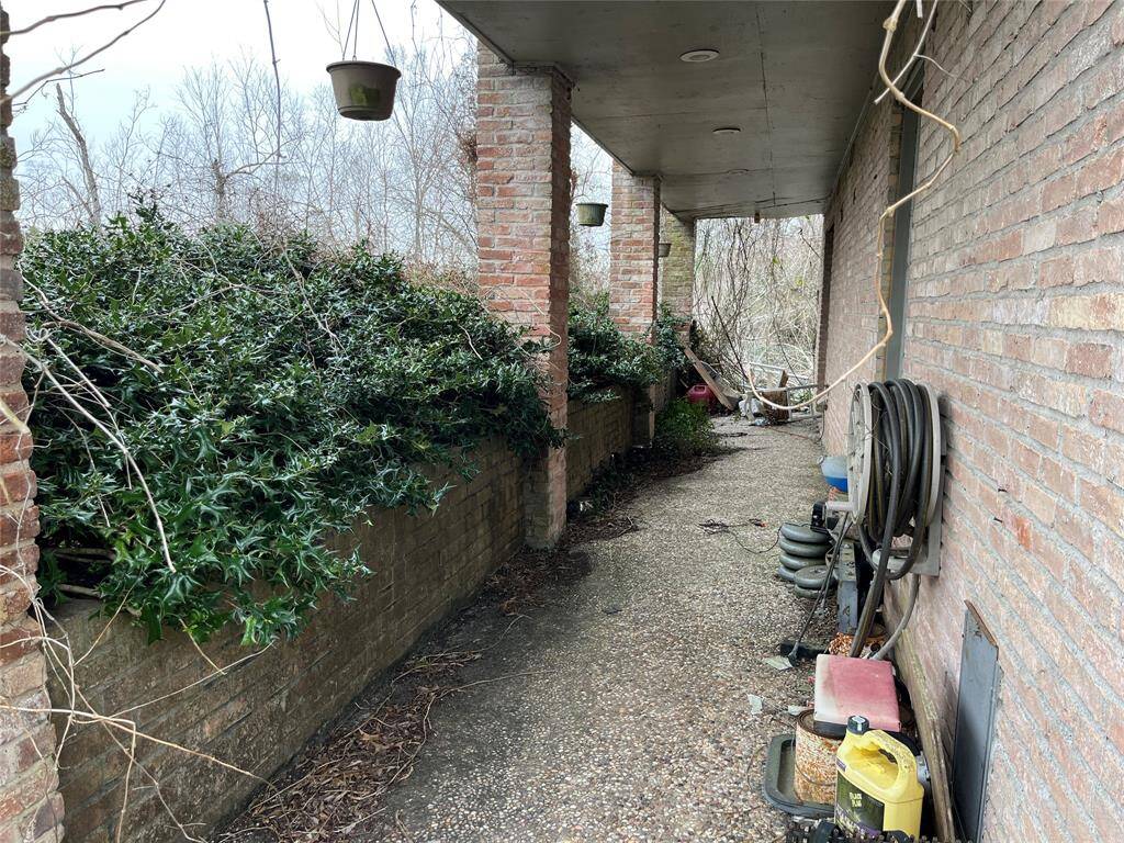 This is the front porch. If you walk down to the far end, you will come up to the pool area.