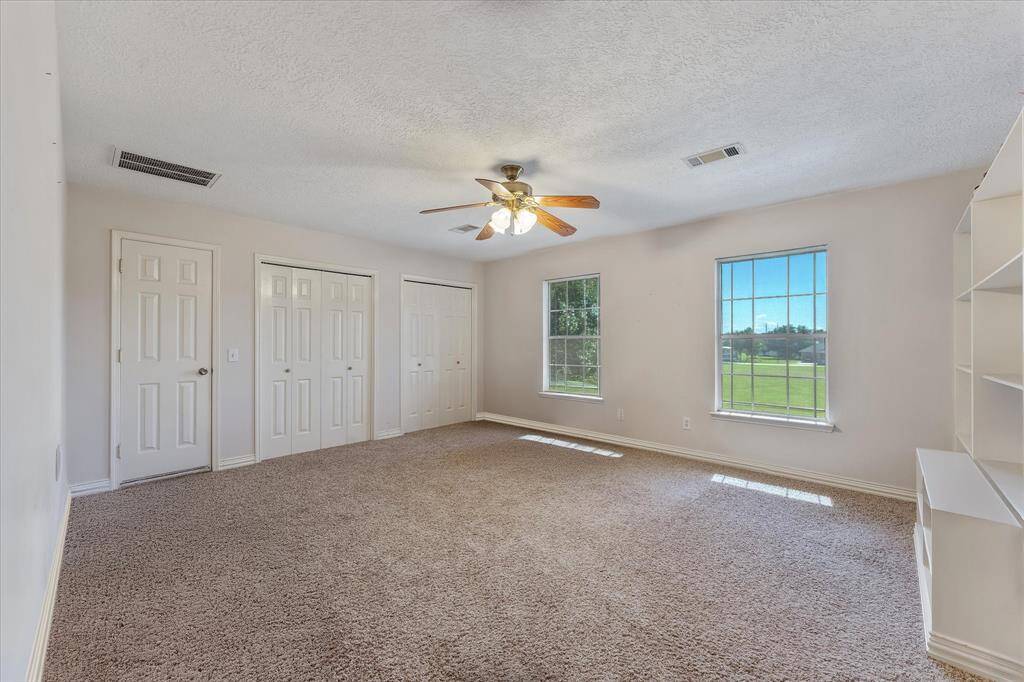 Upstairs gameroom area with storage virtually unstaged