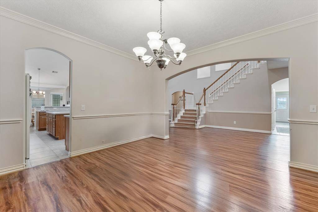 Formal dining looking towards living area virtually unstaged
