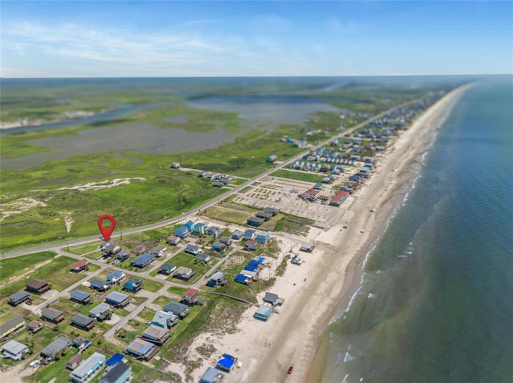 This aerial photo showcases Surfside neighborhood with homes near the beach, offering proximity to the ocean and scenic views.
