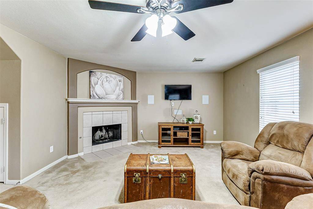 The living area is spacious and has a corner gas fireplace.