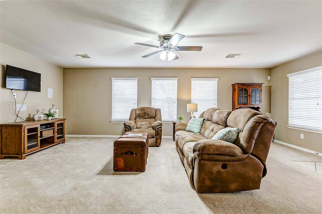 The room is bathed in natural light and large enough for all your furniture.