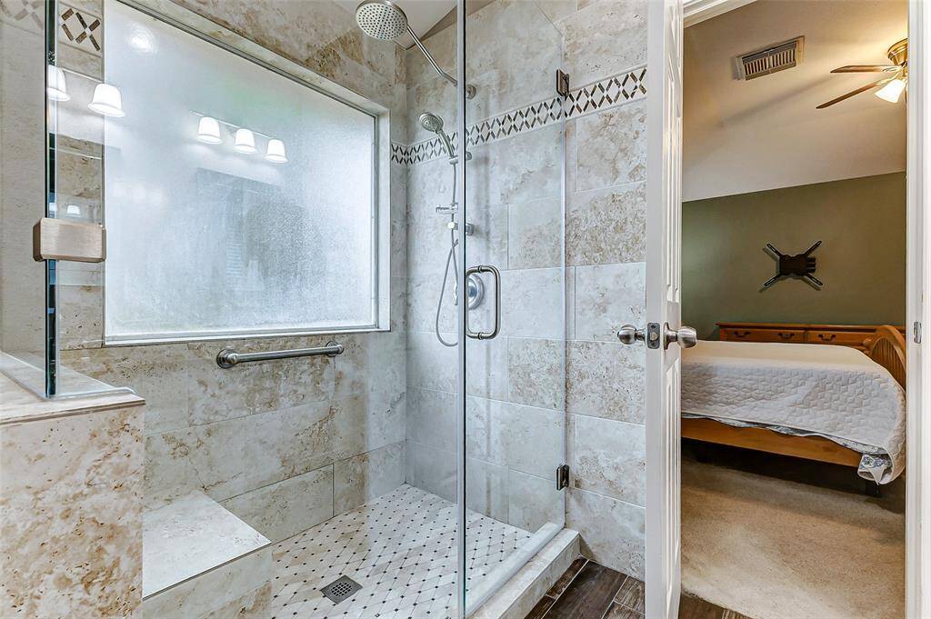 This large walk-in shower will melt your stress away.