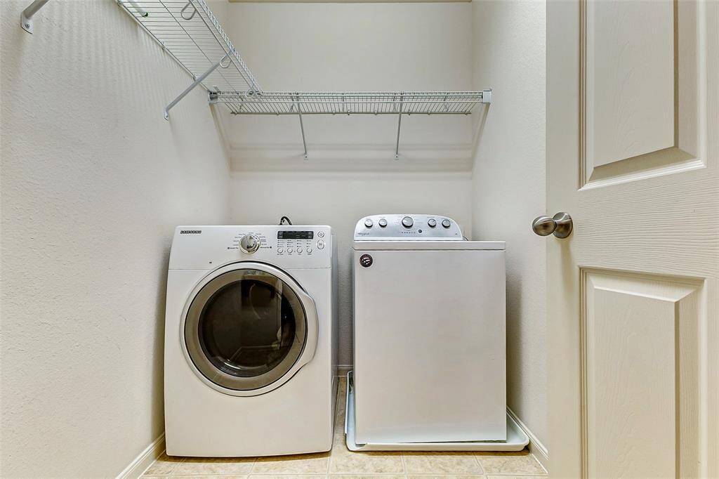 The utility room is located between both secondary bedrooms and across from the secondary full bathroom upstairs which makes doing laundry a breeze.