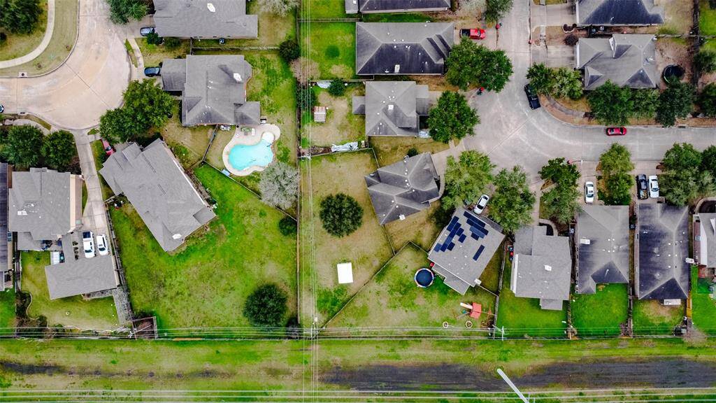 The yard is so large because it is the corner lot. Lots of room to make it your own backyard paradise.