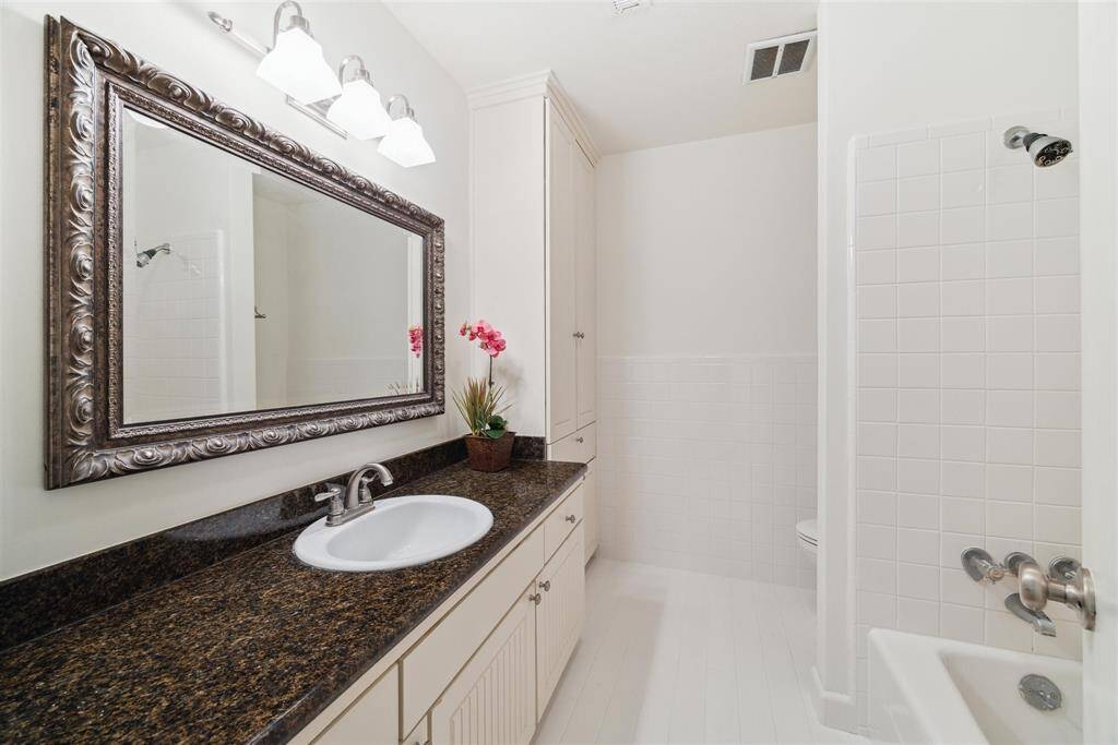 Bathroom upstairs is located between the two bedrooms.