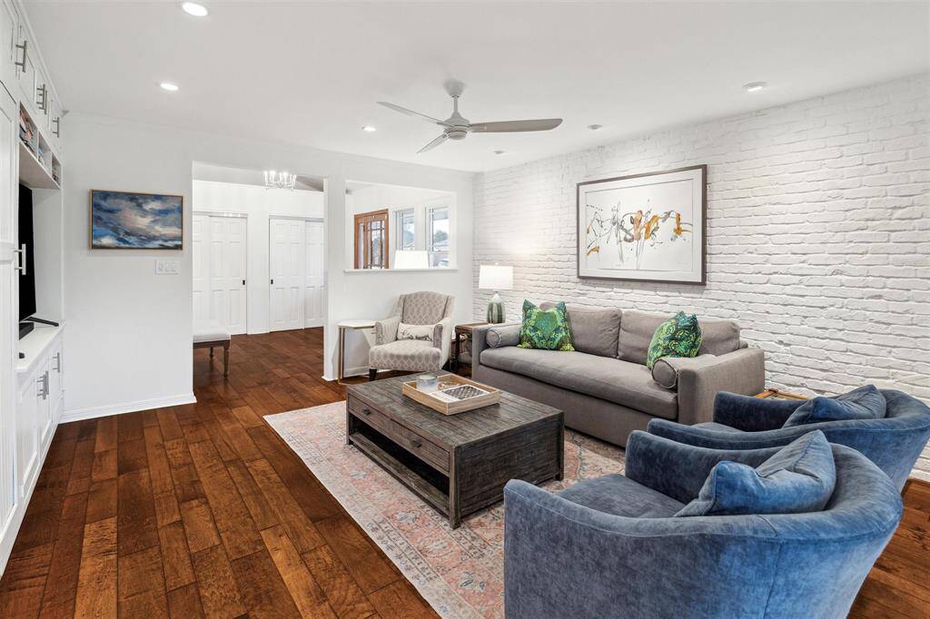 Open sightlines from the dining and living room to the foyer create a warm and welcoming ambiance.