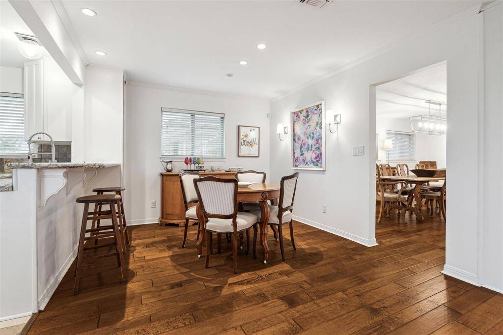 The breakfast room is centrally located between the dining room, kitchen and living room.