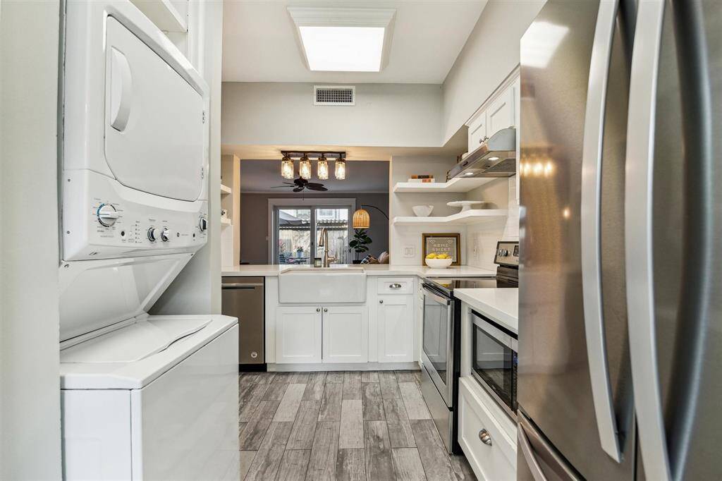 Conveniently tucked in beside the kitchen, you'll find the washer and dryer.