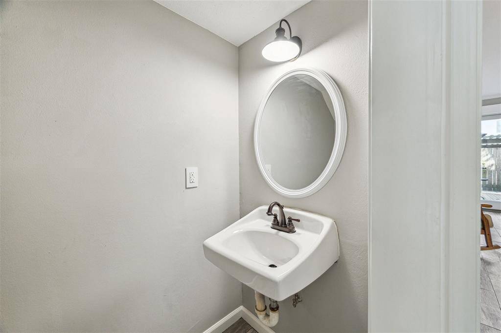 A convenient half bath is just off the living room and services the first floor.