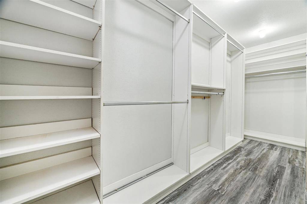 The primary bedroom closet is amazing and runs the full length of the bedroom giving you an abundance of storage space.