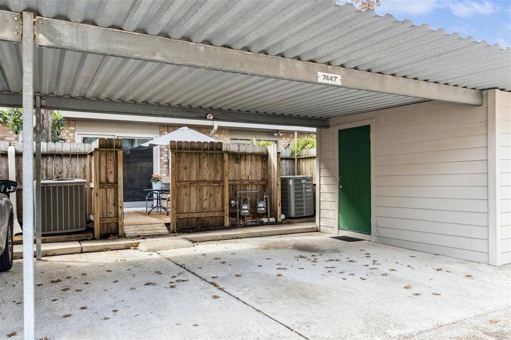 The 2 car dedicated carport features a storage area as well and is just off the back patio.