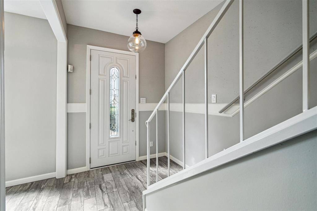 Step inside to discover beautiful flooring and a soft, inviting color palette.