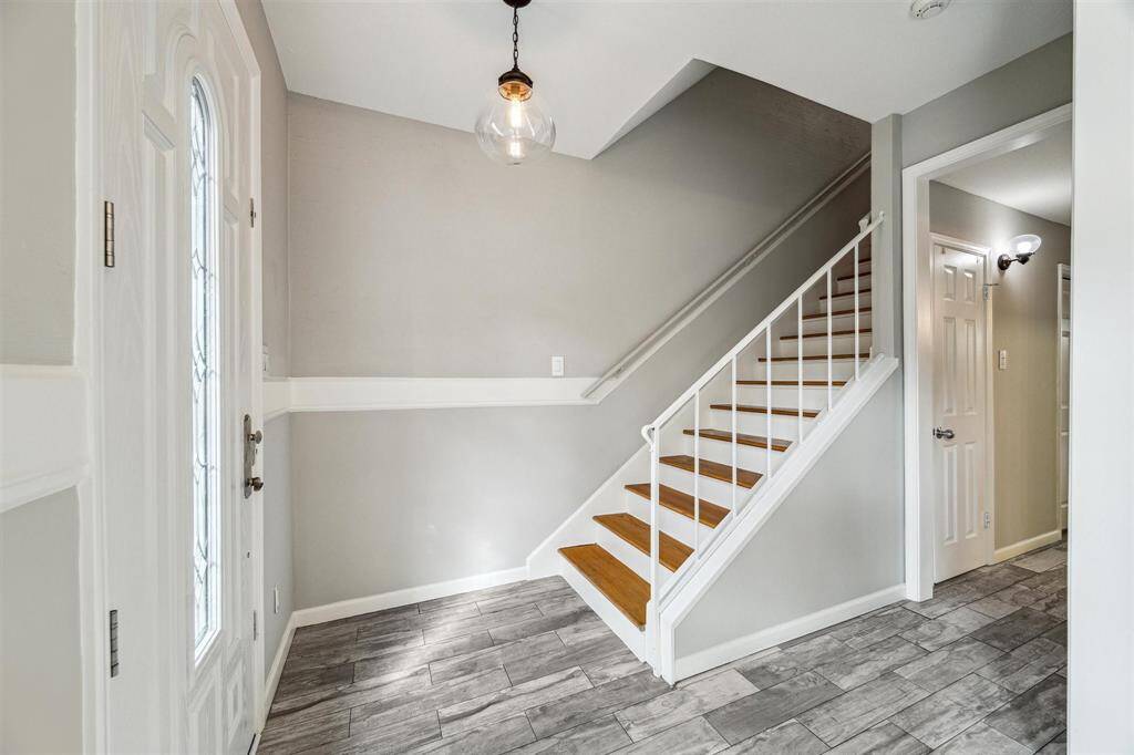 Just off the entry, you'll find the stairs leading to the upper level.