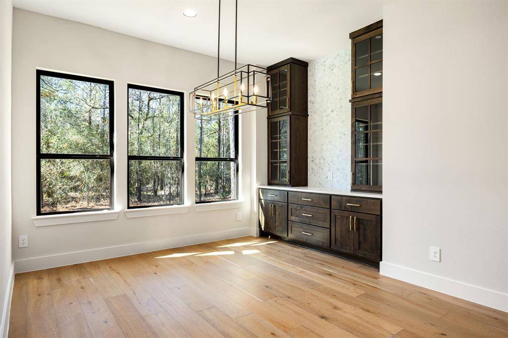 Breakfast nook next to the kitchen with built in cabinets