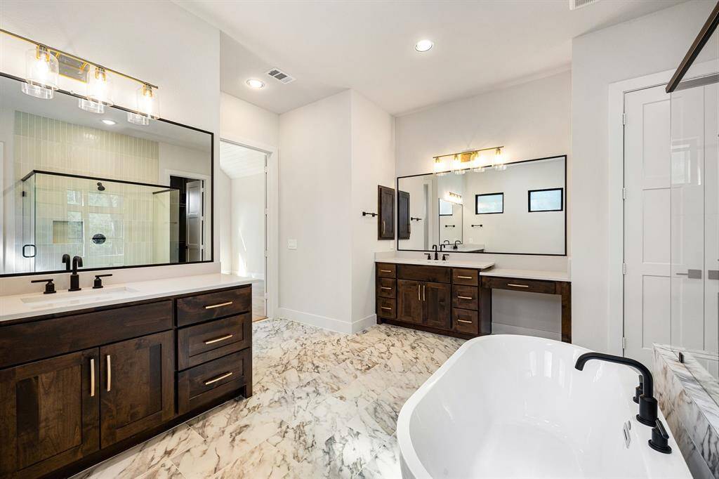 Primary bathroom with dual vanity sinks