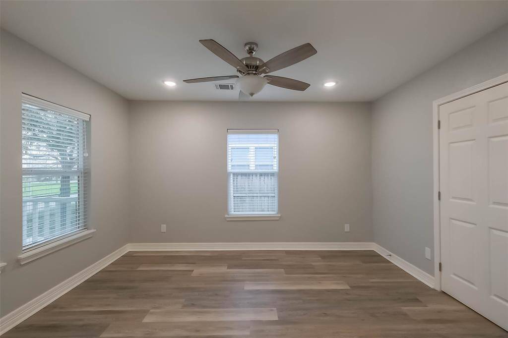 The front bedroom overlooks the great covered patio and has a walk-in closet.