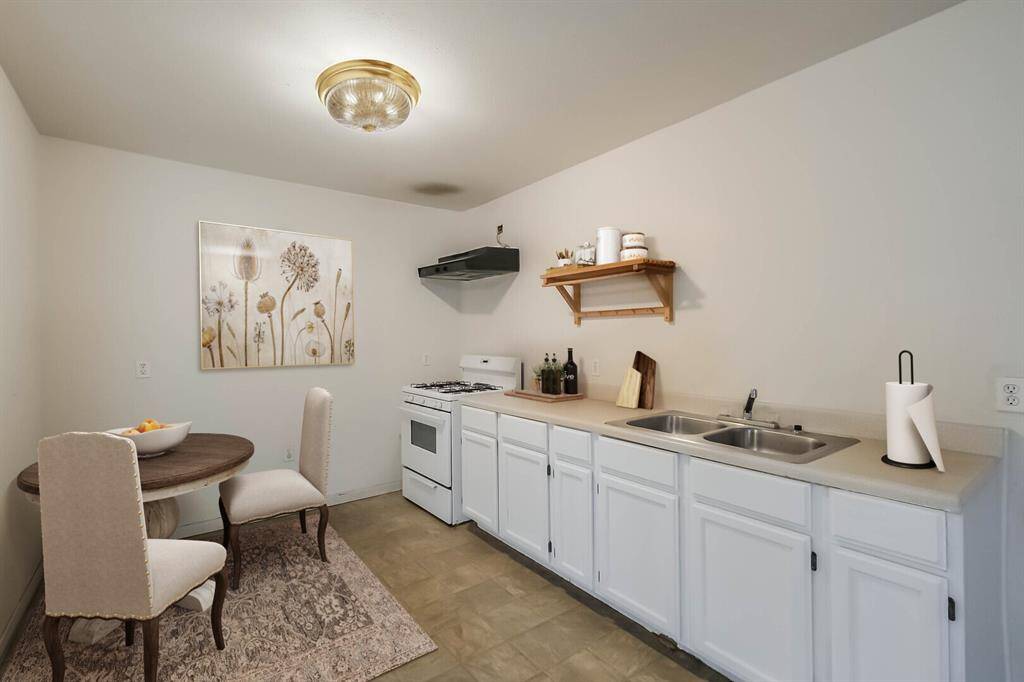Garage apartment kitchen. Virtually staged.