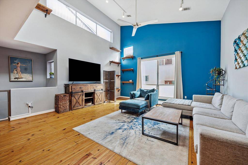 Welcome home to this lovely TH in the Fourth Ward. This is the living area - note the high ceilings.
