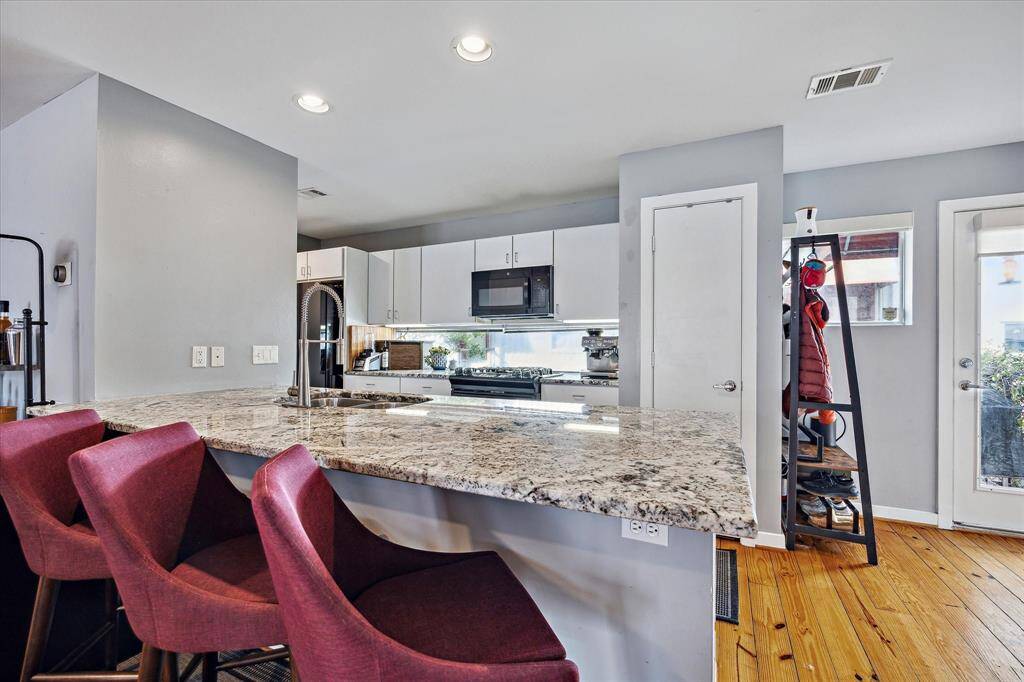 Kitchen area - note the large island and breakfast bar area which creates a great place to visit while entertaining.