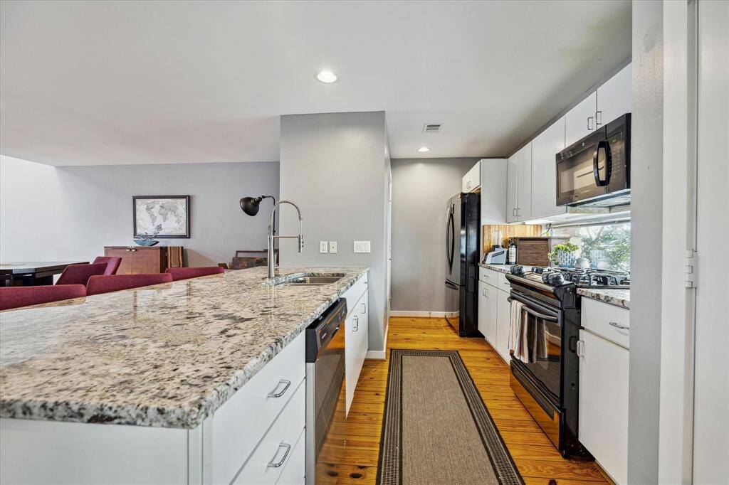View of kitchen - note the window that lets in plenty of light and there's plenty of room for 2 people to move around comfortably.